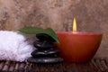 Balanced rocks, candle on bamboo Royalty Free Stock Photo