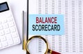 BALANCED SCORECARD on sticker on chart background, business concept