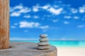 Balanced several Zen stones on blurred beautiful the beach background Royalty Free Stock Photo