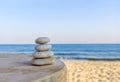 Balanced several Zen stones on blurred beautiful the beach background Royalty Free Stock Photo