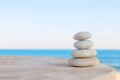 Balanced several Zen stones on blurred beautiful the beach background Royalty Free Stock Photo