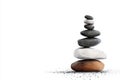 A balanced stack of smooth stones symbolizing tranquility harmony and mindfulness against a clean white background Royalty Free Stock Photo
