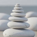 A balanced stack of smooth, white pebbles of varying sizes, resembling a zen stone cairn. The Royalty Free Stock Photo
