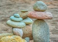 Balanced stacked Rocks on a sandy beach Royalty Free Stock Photo