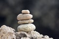 Balanced stacked stones or pebbles on a white sand beach Royalty Free Stock Photo