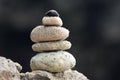 Balanced stacked stones or pebbles on a white sand beach Royalty Free Stock Photo