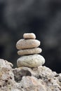 Balanced stacked stones or pebbles on a white sand beach Royalty Free Stock Photo