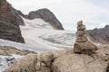 Balanced stone pyramid with Hohes Kreuz mountain