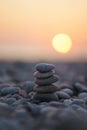 Balanced stone pyramid on pabbles beach with sunset. Zen rock, concept of balance and harmony Royalty Free Stock Photo