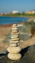 Balanced stone pyramid on sand on beach Royalty Free Stock Photo