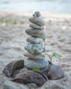 Balanced stone pyramide on the sand beach Royalty Free Stock Photo