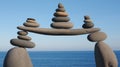 Stone Balancing Art Near the Sea Creates Peaceful Zen Rock Stacks Against Blue Sky Royalty Free Stock Photo
