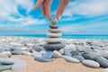 Balanced stone stack with smiley stone under tranquil blue sky Royalty Free Stock Photo