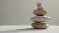 Balanced stone tower on a beige background with copy space Royalty Free Stock Photo