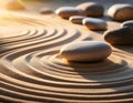Balanced stones on a sand garden with circular patterns Royalty Free Stock Photo