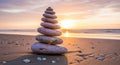 Balanced Stones Stacked on Beach at Sunset Royalty Free Stock Photo