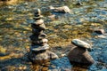 Balanced stones Zen rock stack meditation art in flowing water of mountain stream Royalty Free Stock Photo