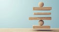 Balanced Wooden Blocks and Spheres on Light Blue Background Royalty Free Stock Photo