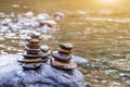 Balanced Zen rock stacks in a creek,View of a creek with stacked stones on a rock Royalty Free Stock Photo