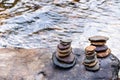 Balanced Zen rock stacks in a creek,View of a creek with stacked stones on a rock Royalty Free Stock Photo