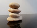 Balanced zen stones on a black table. Royalty Free Stock Photo