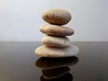 Balanced zen stones on a black table.