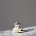 Balanced Zen stones on grey background, sunlight and shadows. Copy space, square image Royalty Free Stock Photo