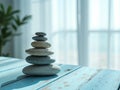 Balanced Zen Stones Stack on Turquoise Table Royalty Free Stock Photo