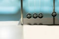 Balancing Balls Newton`s Cradle on blurred backgrounds Royalty Free Stock Photo