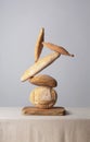 Balancing Bread on a table covered with a tablecloth Royalty Free Stock Photo