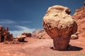 Balancing eroded boulders at the base of a red sandstone table in Vermilion Cliffs National Monument in northern Arizona, near the