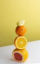 Balancing fruit, creative concept. Pile of colorfull citrus