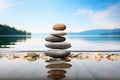 Balancing pebbles on a wooden beach surface, epitomizing Zen serenity