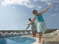 Balancing at the pool Royalty Free Stock Photo