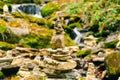 Balancing rock pile on a torrent bed