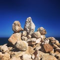 Balancing rocks against Blue Ocean and sky backdrop