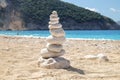 Balancing several of stones on the seashore beach