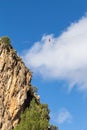 Balancing on a slackline from a steep cliff