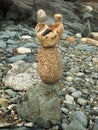 Balancing stone art on a beach