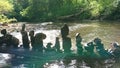 The balancing stone near river landscape