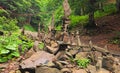 Balancing stones near waterfall Shypit. Stack of stone in summer morning forest. Zakarpattya, Ukraine Royalty Free Stock Photo