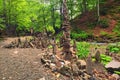 Balancing stones near waterfall Shypit. Stack of stone in summer morning forest. Zakarpattya, Ukraine Royalty Free Stock Photo