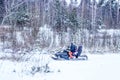 Balashiha, Russia - 4 september 2021 : Family Riding a snowmobile in the forest.