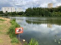 Balashikha, Moscow region, Russia, August, 15. 2020. Sign `swimming prohibited` on the banks of the Pekhorka river. Russia, Moscow Royalty Free Stock Photo