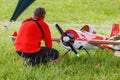 Balashikha, Moscow region, Russia - May 25, 2019: Pilot near big scale RC model of aerobatic aircraft YAK-55 with gasoline engine