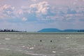 Balaton Lake in Siofok, Hungary. Dramatic Cloudy sky and blue, tourquise water