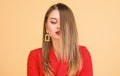 Balayage hair color technique. Pretty woman makeup face red lips. Woman wear glamorous earrings. Hairstyle and Royalty Free Stock Photo