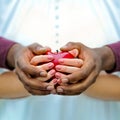 Balck and white hands with a red apple Royalty Free Stock Photo