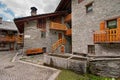 Balconies in the alpine village street stone houses Royalty Free Stock Photo