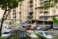 The balconies of an apartment building are hung with clothes. The poor area. Moments of Ordinary Life